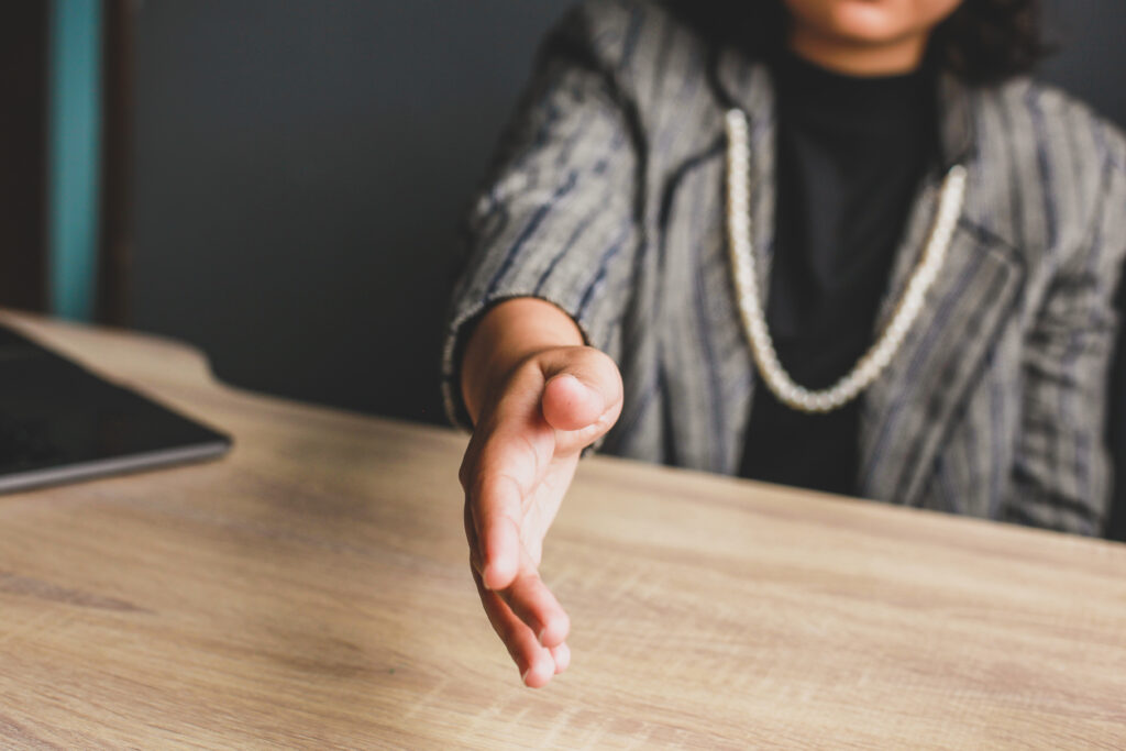 Woman extending hand to shake
