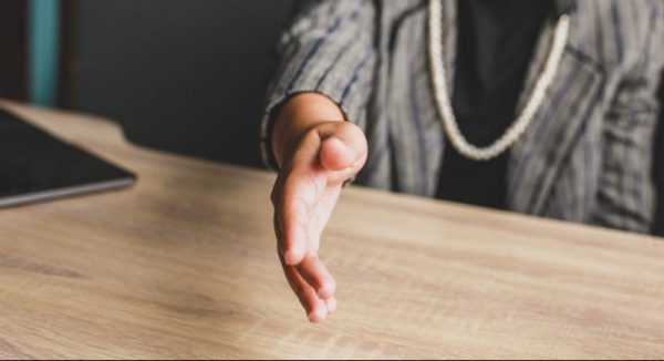 Woman extending hand to shake